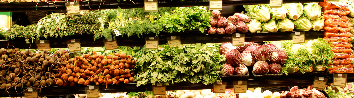 A wide variety of fresh vegetables showcased in a grocery store